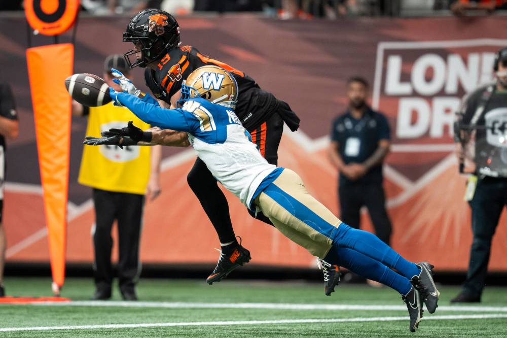 ETHAN CAIRNS / THE CANADIAN PRESS
Winnipeg Blue Bombers’ Deatrick Nichols, right, blocks a pass to B.C. Lions’ Ayden Eberhardt (19) during the first half of a CFL football game in Vancouver, on Saturday, June 21, 2025.