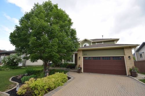 A rich-looking exterior gives this two-storey home tons of curb appeal.