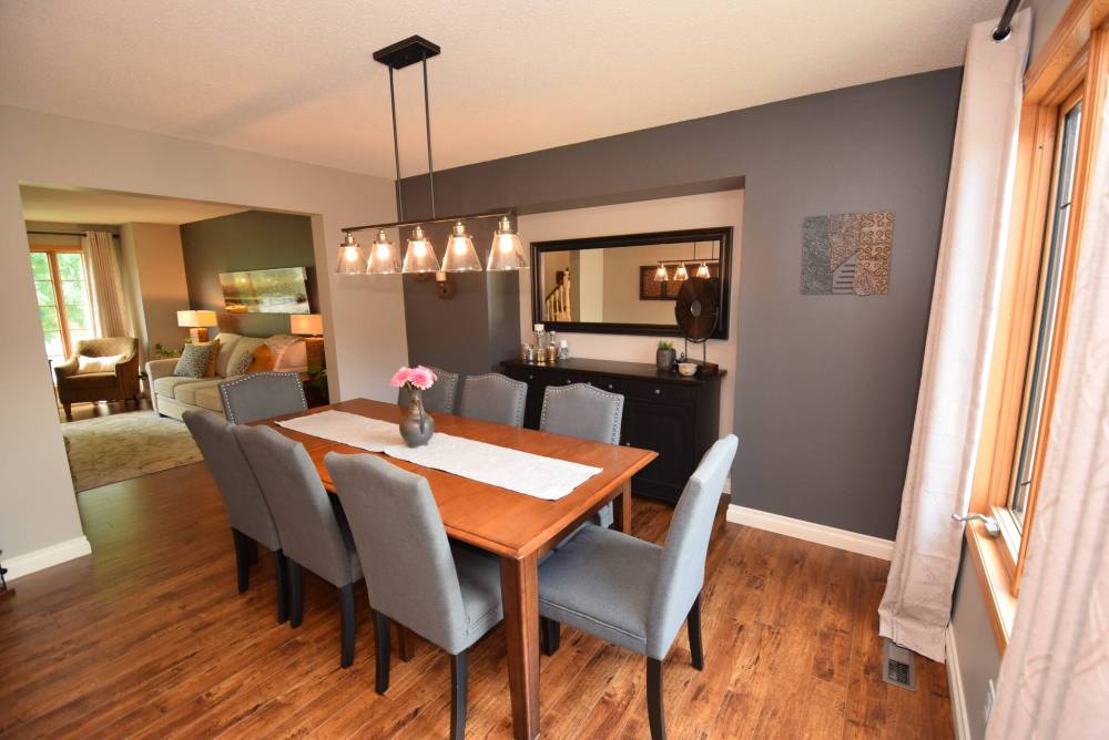 The formal dining room easily seats eight and connects seamlessly with the living room via a six-foot-wide doorway.