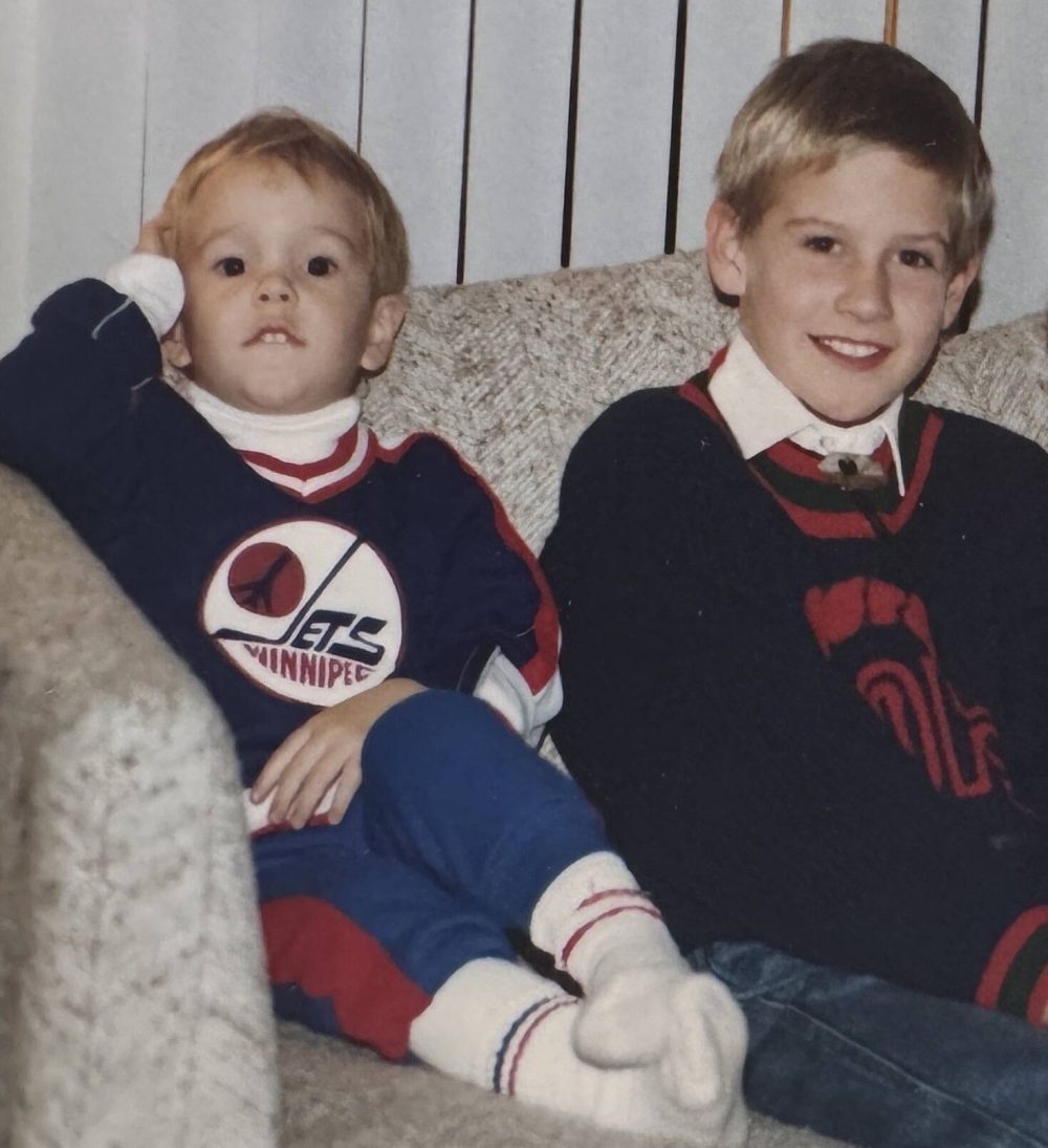 SUPPLIED
Jonathan Toews (left) wears his Jets 1.0 jersey while sitting beside his cousin Kurt Enns when they were growing up together in Winnipeg.