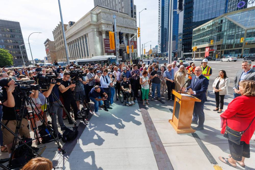 MIKE DEAL / FREE PRESS
Mayor Scott Gillingham addressed the assembled crowd before walking across the street, marking the official opening of the pedestrian crosswalks at Portage and Main.