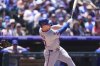 New York Mets' Pete Alonso follows the flight of his two-run home run off Colorado Rockies starting pitcher Chase Dollander in the third inning of a baseball game Sunday, June 8, 2025, in Denver. (AP Photo/David Zalubowski)