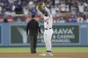 Los Angeles Dodgers' Enrique Hernández gestures after hitting a double during the third inning of a baseball game against the Washington Nationals in Los Angeles, Friday, June 20, 2025. (AP Photo/Jessie Alcheh)