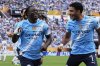 Manchester City's Jeremy Doku, left, celebrates after scoring the opening goal during the Club World Cup Group G soccer match between Juventus and Manchester City in Orlando, Fla., Thursday, June 26, 2025. (AP Photo/John Raoux)