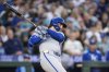 Kansas City Royals' Vinnie Pasquantino hits a two-run single during the seventh inning of a baseball game against the Seattle Mariners, Thursday, July 3, 2025, in Seattle. (AP Photo/Stephen Brashear)