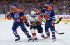 Florida Panthers' Brad Marchand (63) skates between Edmonton Oilers' Darnell Nurse (25) and Jake Walman (96) during third period of Game 5 of the NHL Stanley Cup final, in Edmonton, on Saturday, June 14, 2025. THE CANADIAN PRESS/Darryl Dyck