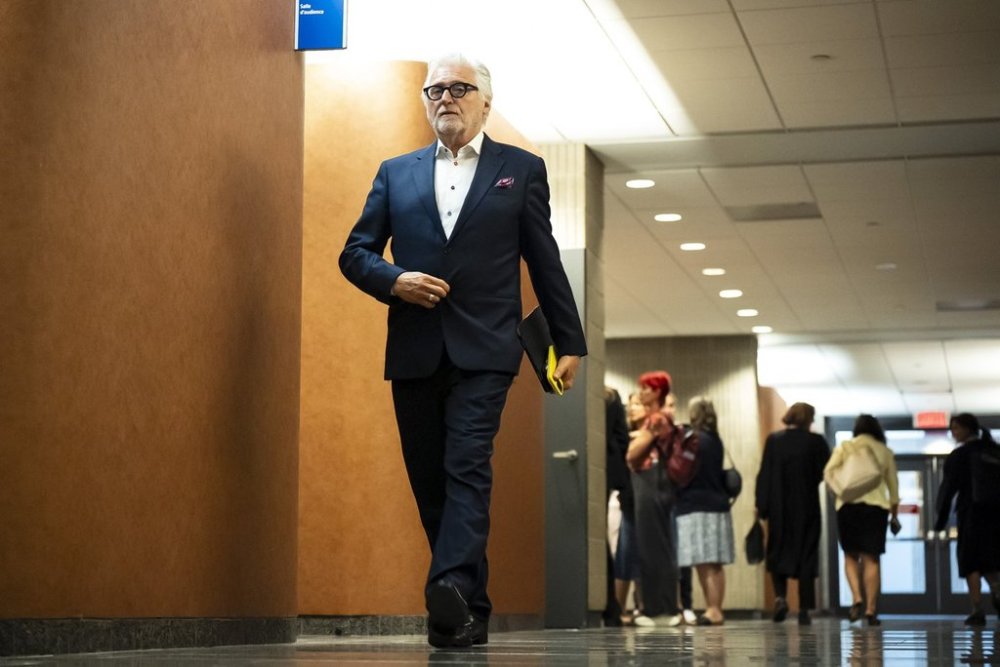 Just for Laughs founder Gilbert Rozon is seen in the corridors of the Montreal courthouse during a break in his civil trial on Monday, June 30, 2025. *THE CANADIAN PRESS/Christopher Katsarov*