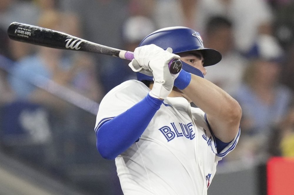 Toronto Blue Jays' Joey Loperfido hits an RBI single off Los Angeles Angels pitcher Tyler Anderson during fourth inning MLB baseball action in Toronto, Sunday, July 6, 2025. THE CANADIAN PRESS/Chris Young