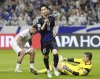 Japan's Daichi Kamada, center, celebrates after scoring his side's second goal during the World Cup 2026 group C qualifying soccer match between Japan and Indonesia in Suita, Japan, Tuesday, June 10, 2025. (Shohei Miyano/Kyodo News via AP)