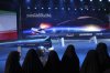 FILE - Women look at Fattah missile in a ceremony in Tehran, Iran, Tuesday, June 6, 2023. (Hossein Zohrevand/Tasnim News Agency via AP, File)
