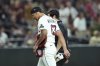 Arizona Diamondbacks pitcher Justin Martinez leaves the game due to injury during the ninth inning of a baseball game against the Seattle Mariners Monday, June 9, 2025, in Phoenix. (AP Photo/Ross D. Franklin)