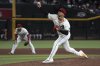 Arizona Diamondbacks pitcher Justin Martinez throws against the Washington Nationals in the ninth inning during a baseball game, Sunday, June 1, 2025, in Phoenix. (AP Photo/Rick Scuteri)