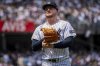 New York Yankees pitcher Clarke Schmidt (36) walks off the field during the fourth inning of a baseball game against the Athletics, Saturday, June 28, 2025, in New York. (AP Photo/Angelina Katsanis)