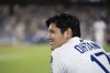 Los Angeles Dodgers' Shohei Ohtani smiles during the seventh inning of a baseball game against the San Diego Padres, in Los Angeles, Tuesday, June 17, 2025. (AP Photo/Kyusung Gong)