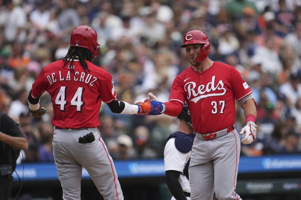 Cincinnati Reds' Tyler Stephenson (37)celebrates his grand slam with Elly De La Cruz (44) against the Detroit Tigers in the fifth inning during a baseball game, Saturday, June 14, 2025, in Detroit. (AP Photo/Paul Sancya)