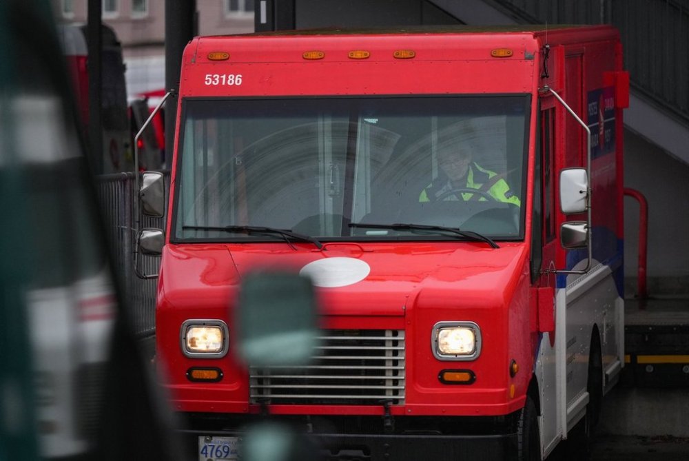 A Canada Post employee parks a truck at a delivery depot in Vancouver, B.C., Tuesday, Dec. 17, 2024. THE CANADIAN PRESS/Darryl Dyck