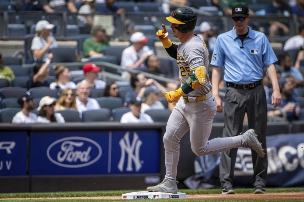 Athletics' Brent Rooker (25) celebrates a home run during the fourth inning of a baseball game against the New York Yankees, Saturday, June 28, 2025, in New York. (AP Photo/Angelina Katsanis)