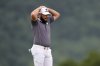 Tyrrell Hatton, of England, reacts after hitting his ball into the rough on the 17th hole during the final round of the U.S. Open golf tournament at Oakmont Country Club Sunday, June 15, 2025, in Oakmont, Pa. (AP Photo/Seth Wenig)
