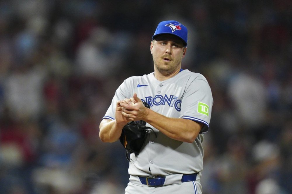 Toronto Blue Jays pitcher Erik Swanson reacts after giving up a run to the Phillies in the eighth inning of a Major League Baseball game on Friday, June 13, 2025, in Philadelphia. (AP Photo/Derik Hamilton)