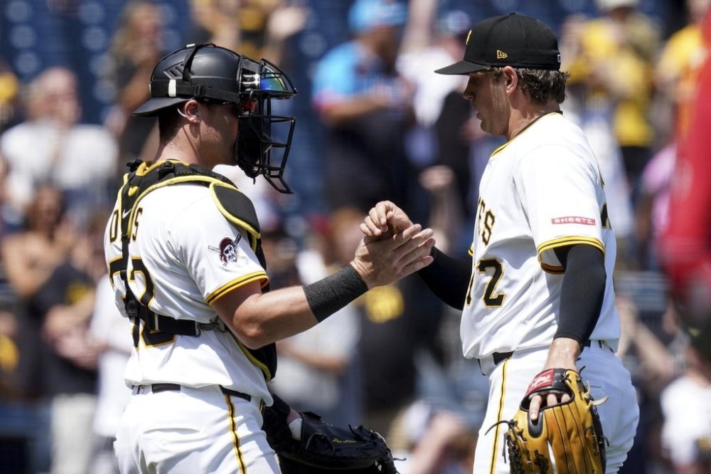 Pittsburgh Pirates pitcher Isaac Mattson, right, celebrates with catcher Henry Davis, after getting the final out of a baseball game against the St. Louis Cardinals, Wednesday, July 2, 2025, in Pittsburgh. (AP Photo/Matt Freed)