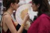 Demonstrators use fans to help with the high temperature during a protest against the housing crisis affecting Portugal, in Lisbon, Saturday, June 28, 2025. (AP Photo/Armando Franca)
