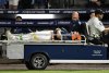 Tampa Bay Rays' Hunter Bigge is taken off the field after being hit by a foul ball while in the dugout during the seventh inning of a baseball game against the Baltimore Orioles, Thursday, June 19, 2025, in Tampa, Fla. (AP Photo/Jason Behnken)