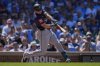 Seattle Mariners' Cal Raleigh hits a two-run home run during the seventh inning of a baseball game against the Chicago Cubs, Friday, June 20, 2025, in Chicago. (AP Photo/Erin Hooley)