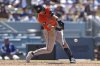 Houston Astros' Zack Short hits a single during the eighth inning of a baseball game against the Los Angeles Dodgers, Sunday, July 6, 2025, in Los Angeles. (AP Photo/Jessie Alcheh)