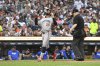 Minnesota Twins' Byron Buxton (25) reacts after hitting a home run as home plate Todd Tichenor, right, looks on during the fifth inning of a baseball game against the Detroit Tigers, Friday, June 27, 2025, in Detroit. (AP Photo/Jose Juarez)
