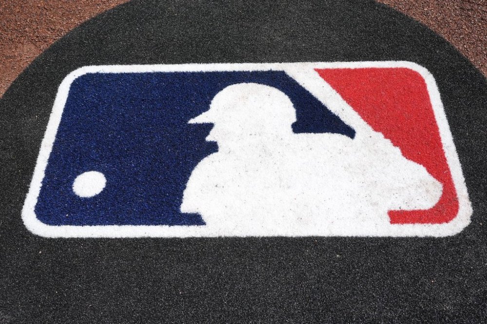 FILE - The Major League Baseball logo is seen on the field before a spring training baseball game between the Pittsburgh Pirates and the Atlanta Braves Tuesday, Feb. 27, 2024, in Bradenton, Fla. (AP Photo/Charlie Neibergall, file)