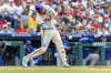 Philadelphia Phillies Nick Castellanos hits a grand slam during the sixth inning of a baseball game against the Toronto Blue Jays, Sunday, June 15, 2025, in Philadelphia. (AP Photo/Laurence Kesterson)
