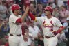 St. Louis Cardinals' Nolan Gorman (16) is congratulated by teammate Nolan Arenado after hitting a two-run home run during the sixth inning of a baseball game against the Chicago Cubs Monday, June 23, 2025, in St. Louis. (AP Photo/Jeff Roberson)