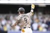 San Diego Padres' Jake Cronenworth celebrates after hitting a walkoff single during the 10th inning of a baseball game against the Texas Rangers, Friday, July 4, 2025. (AP Photo/Denis Poroy)