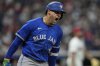 Toronto Blue Jays' George Springer shouts as he runs the bases with a home run in the eighth inning of a baseball game against the Cleveland Guardians in Cleveland, Tuesday, June 24, 2025. (AP Photo/Sue Ogrocki)