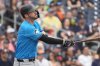 FILE - Miami Marlins' Trey Mancini watches his solo home run during the second inning of a spring training baseball game against the Houston Astros, March 10, 2024, in West Palm Beach, Fla. (AP Photo/Jeff Roberson, File)