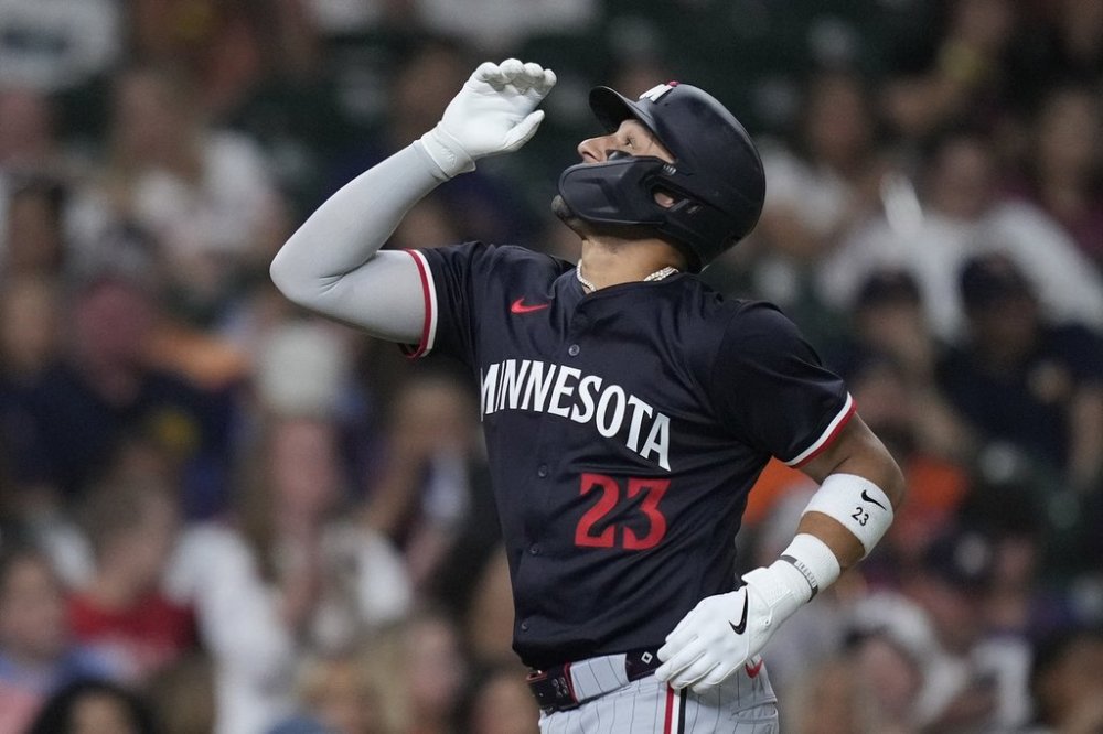 Minnesota Twins' Royce Lewis celebrates after hitting a solo home run during the sixth inning of a baseball game against the Houston Astros, Friday, June 13, 2025, in Houston. (AP Photo/Kevin M. Cox)