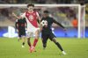 FILE - Barcelona's Ansu Fati, right, fights for the ball with Monaco's Maghnes Akliouche during the Champions League opening phase soccer match between Monaco and Barcelona at the Louis II stadium, in Monaco, Monaco, Thursday, Sept. 19, 2024. (AP Photo/Laurent Cipriani, File)