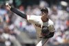 San Francisco Giants pitcher Sean Hjelle throws against the Miami Marlins during the eighth inning of a baseball game in San Francisco, Thursday, June 26, 2025. (AP Photo/Jeff Chiu)