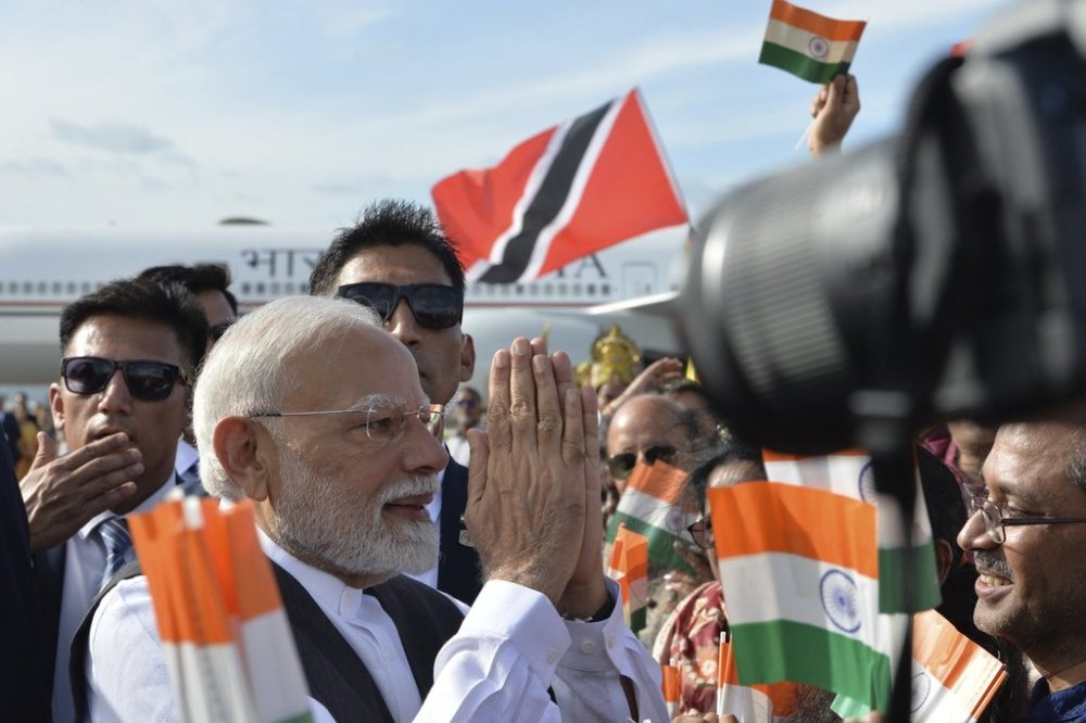 Indian Prime Minister Narendra Modi greets people upon arriving at Piarco International Airport in Piarco, Trinidad and Tobago, Thursday, July 3, 2025. (AP Photo/Jermaine Cruickshank)