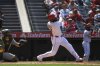 Los Angeles Angels' Jo Adell, right, hits a two-run home run as Athletics catcher Willie MacIver watches during the sixth inning of a baseball game Wednesday, June 11, 2025, in Anaheim, Calif. (AP Photo/Mark J. Terrill)