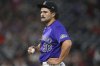 Colorado Rockies relief pitcher Zach Agnos waits to be pulled from the mound after issuing a walk to San Francisco Giants' Willy Adames in the ninth inning of a baseball game Tuesday, June 10, 2025, in Denver. (AP Photo/David Zalubowski)