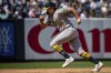 Athletics' Nick Kurtz (16) scores a run on error during Austin Wynns' single during the eighth inning of a baseball game against the New York Yankees, Saturday, June 28, 2025, in New York. (AP Photo/Angelina Katsanis)