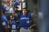 Kansas City Royals' Jac Caglianone celebrates in the dugout after hitting his first career home run during a baseball game against the Texas Rangers, Thursday, June 19, 2025, Arlington, Texas. (AP Photo/Albert Pena)