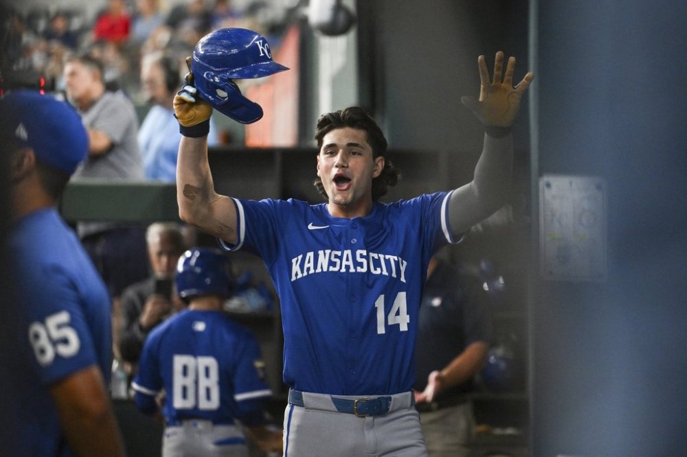 Kansas City Royals' Jac Caglianone celebrates in the dugout after hitting his first career home run during a baseball game against the Texas Rangers, Thursday, June 19, 2025, Arlington, Texas. (AP Photo/Albert Pena)
