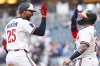 Minnesota Twins' Byron Buxton, left, celebrates his three-run home run with Christian Vázquez during the third inning of baseball game against the Texas Rangers, Wednesday, June 11, 2025, in Minneapolis. (AP Photo/Matt Krohn)