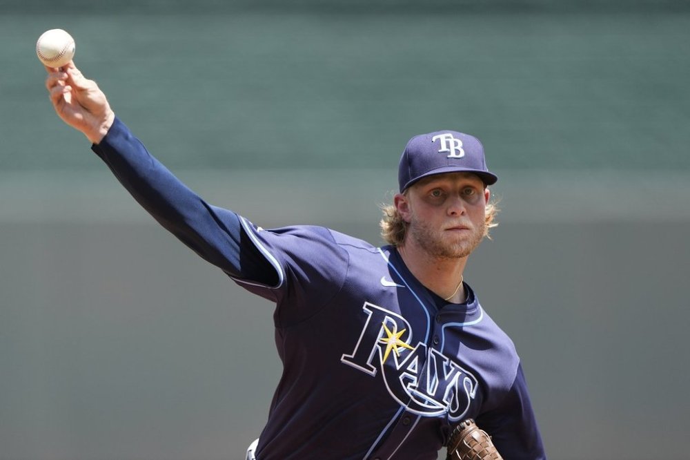 Tampa Bay Rays starting pitcher Shane Baz throws during the first inning of a baseball game against the Kansas City Royals, Thursday, June 26, 2025, in Kansas City, Mo. (AP Photo/Charlie Riedel)