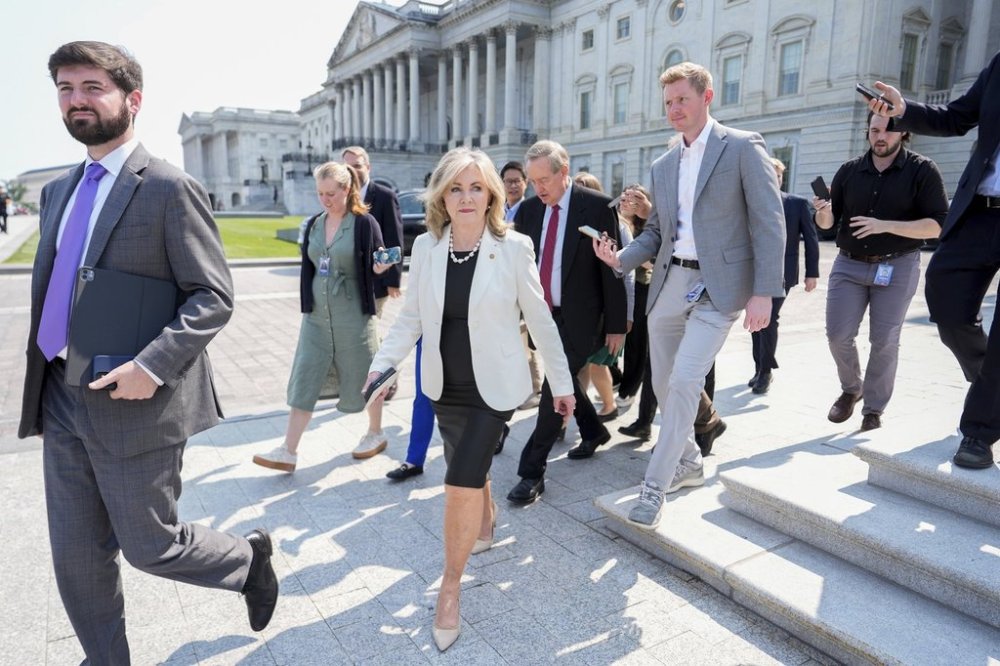 Sen. Marsha Blackburn, R-Tenn., walks to board a bus to the White House with other Senate Republicans for a meeting with President Donald Trump on his spending and tax bill, Wednesday, June 4, 2025, outside the U.S. Capitol in Washington. (AP Photo/Julia Demaree Nikhinson)