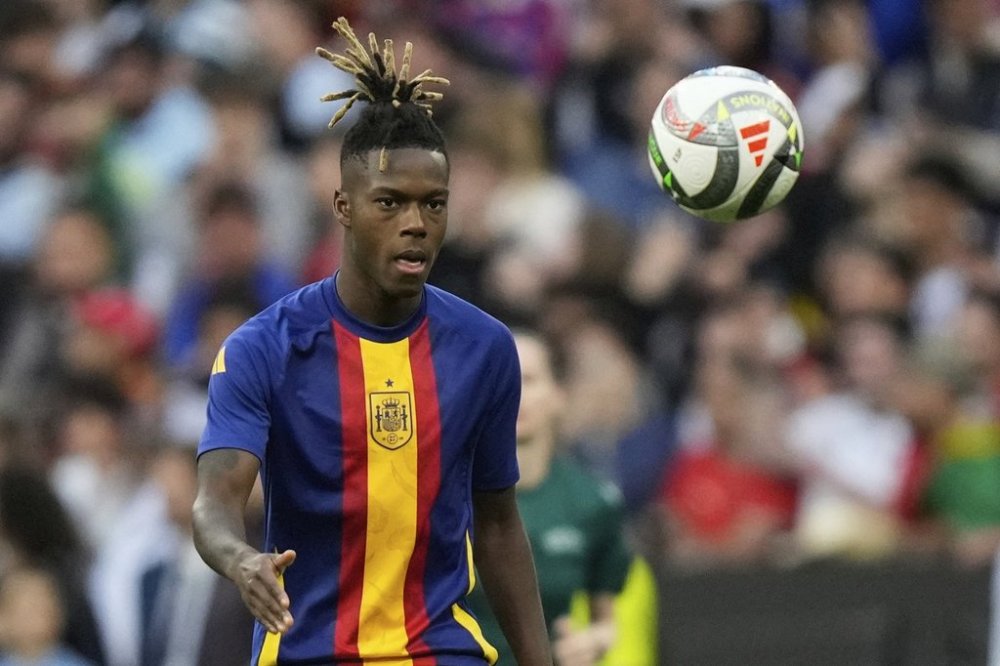 FILE -Spain's Nico Williams eyes the ball prior the start of the Nations League final soccer match between Portugal and Spain at the Allianz Arena in Munich, Germany, June 8, 2025. (AP Photo/Matthias Schrader, File)