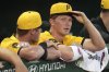 Pittsburgh Pirates pitcher Mitch Keller, right, stands in the dugout with catcher Henry Davis, after being pulled in the sixth inning of a baseball game against the New York Mets in Pittsburgh, Friday, June 27, 2025. (AP Photo/Gene J. Puskar)