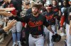 Baltimore Orioles' Jordan Westburg high-fives teammates in the dugout after hitting a solo home run in the third inning of a baseball game against the Atlanta Braves, Friday, July 4, 2025, in Atlanta. (AP Photo/Colin Hubbard)